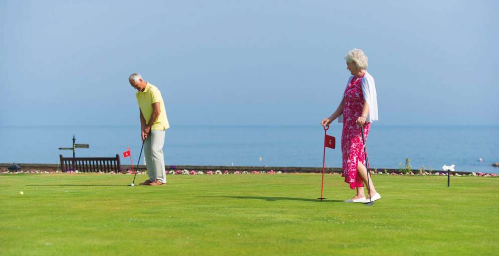 Belmont Hotel Couple Enjoying Putting Green on the Hotel Lawn