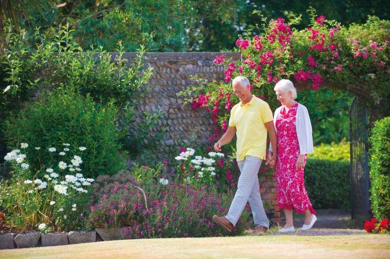 Belmont Hotel Couple Enjoying Hotel Gardens